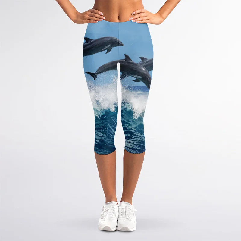 Dolphins Jumping Over Waves Print Women's Capri Leggings